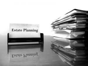 Estate Planning business card on desk with files